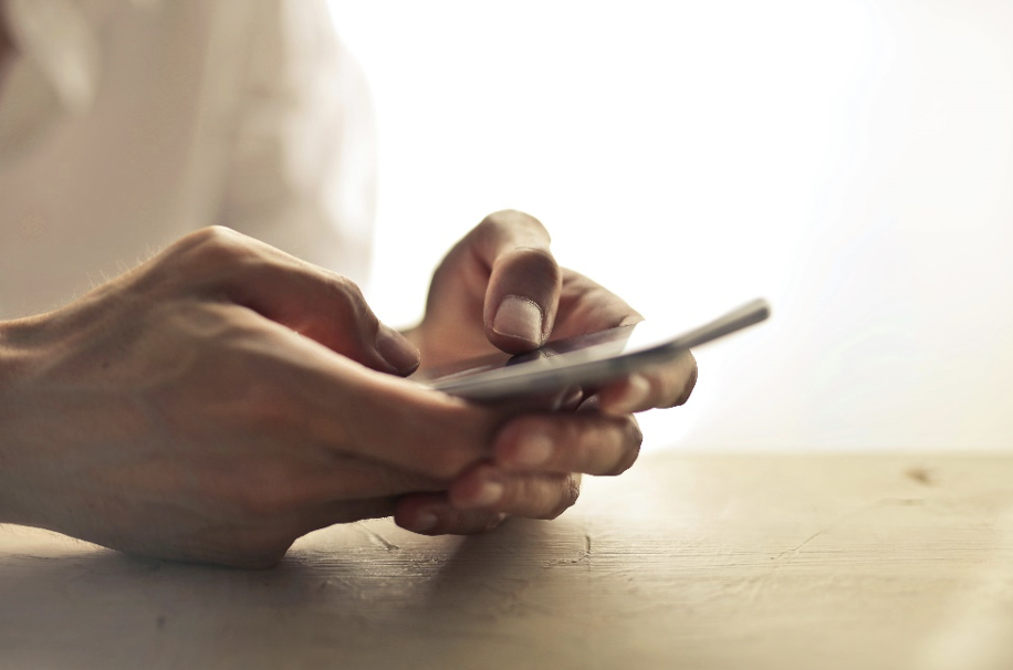 Close-up shot of a person holding a cell phone