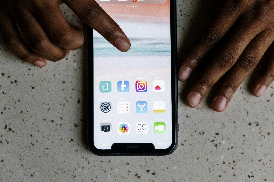 Person touching a phone’s screen