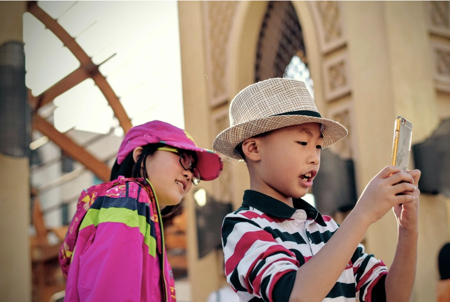 Two kids posing for a selfie together 